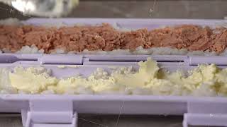 Chef spreading rice on nori sheet using sushi machine [upl. by Sherard329]