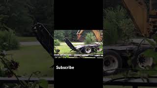 Loading a backhoe on a trailer shorts shortbackhoe trailer Heavy Ramps 🥵 [upl. by Valerio44]