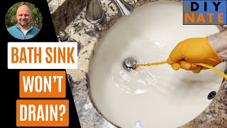 Easy Fix for Slow Draining Bath Sink Using Plastic Zip to Unclog Sink [upl. by Citarella]