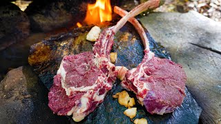 VERY JUICY AND DELICIOUS RIBEYE STEAK COOKED ON A ROCK  PERFECT TOMAHAWK STEAK IN THE WOODS [upl. by Adyl636]