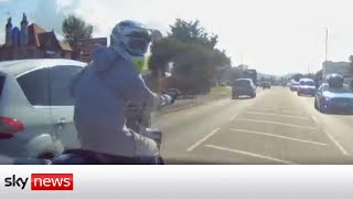 Road rage driver knocks motorcyclist off bike after 50mph chase [upl. by Ahtimat796]