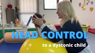 Facilitating head control to a dystonic quadriplegic child with cerebral palsy NDT intervention [upl. by Fishback]