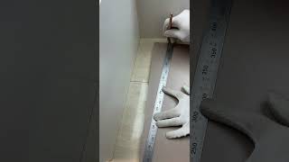 The process of measuring and installing wooden floor tiles in an uneven corner [upl. by Burra]