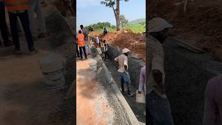 Concrete trapezoidal drainage under construction 🚧 constructiontips roadconstruction drainage [upl. by Suivatco]