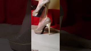 Beautiful woman wears a mini dress and golden glitter shoes in this unforgettable video [upl. by Liakim519]