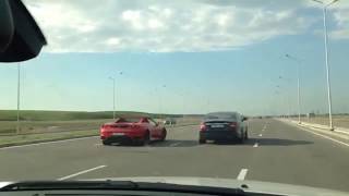 Mercedes CLS55 AMG vs Ferrari F430 Spider [upl. by Aronas8]