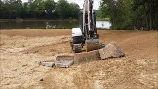 DIY Building concrete Ditch water barrier with Bobcat Excavator [upl. by Alfons]