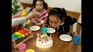 Funny girl blowing candle on sisters birthday cake [upl. by Guild]