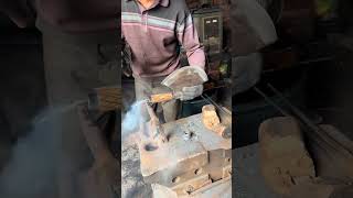 The blacksmith is installing the handle on the bone chopping knife [upl. by Tertias]