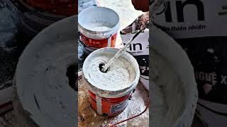 Mixing paint to paint walls painter construction shorts [upl. by Nace]