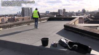 Stripping a old felt roof and overlaying with a new roofing membrane [upl. by Aikemehs783]