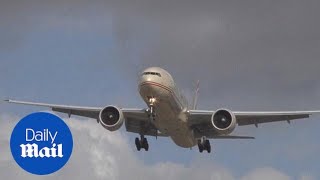 Incredible footage shows plane HOVERING in crosswind  Daily Mail [upl. by Slavin]