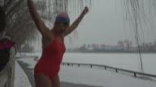 Hardy few extol rewards of icy dip in Beijing lake [upl. by Eeryk564]