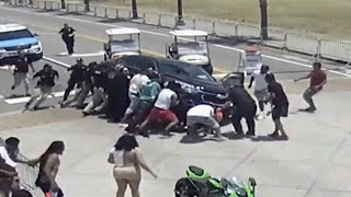 Good Samaritans Race to Lift Car off Motorcyclist [upl. by Ibbob]