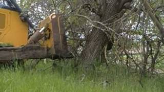 John Deere 850J pushing trees [upl. by Aisylla727]