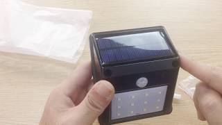 12LED Solar Powered PIR Motion Sensor Wall Light Review [upl. by Ydualc483]