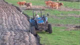 Tractor New Holland TD80 D with front end loader ploughing  plowing Trator a lavrar [upl. by Ynaiffit]