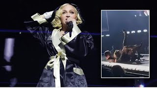 Madonna Suffers A Fall From A Chair During Her Concert In Seattle [upl. by Enirehtak]