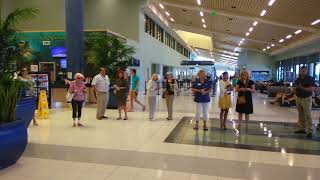 Ukulele Orchestra of St Andrews plays for arriving passengers [upl. by Kuster]