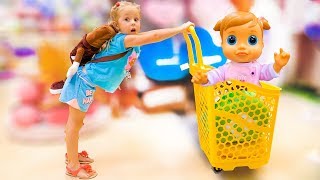 Nastya and baby doll doing shopping  song for kids Nursery Rhyme by Nastya at the candy shop [upl. by Aivin206]