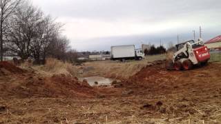 Bobcat s185 digging a retention pond [upl. by Ymiaj]