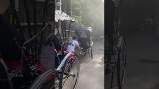 Japanese man pulling rickshaw with tourists in Kyoto Japan [upl. by Gardol]