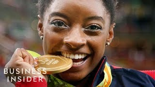 Heres Why Olympic Athletes Bite Their Medals  Business Insider [upl. by Yrol]