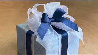 How to tie a double ribbon bow for lovely gift wrapping [upl. by Uohk114]