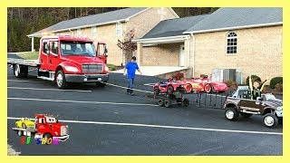 Towing The Rollback With His Powered Ride On Dodge Ram Two Car Trailer [upl. by Slavin]