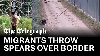 Migrants throw makeshift spears at Polish border guards [upl. by Kampmann]