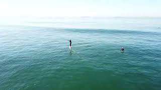 Huntington Beach Cliffs Surfing Drone view Hydrofoiling [upl. by Yrelav672]