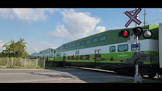 Go Train Engine 678 passing through Louth St crossing St Catharines got honks and waves [upl. by Atteinotna]