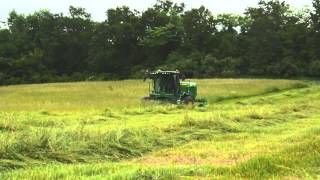 John Deere W235 SelfPropelled Windrower Video [upl. by Aicirtap]