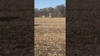 Moving Cornstalk Bales johndeere powershift farming [upl. by Enttirb]