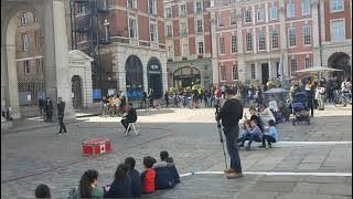 A Street Comedian amp Magician buskerLondonSitting on bed of nails [upl. by Bohaty]