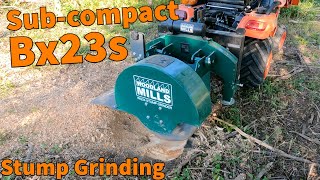 BX23s Stump Grinding WG24 Woodland Mills [upl. by Akiemat]