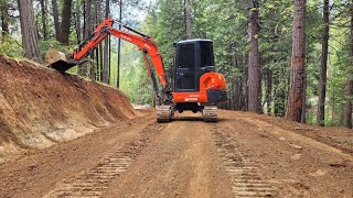 Stumps slopes and road with the Kubota KX040 [upl. by Enelia]