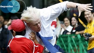 Boris Johnson knocks over boy in rugby match in Japan [upl. by Ynnoj]