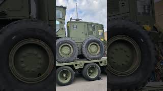 Oshkosh Mk48 Container handler carrying CAT Grader [upl. by Neeneg]