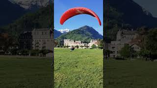 Smooth Tandem Paragliding Landing on Interlakens Green Meadow [upl. by Assilem450]