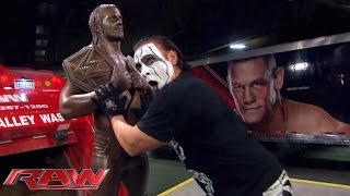 Sting destroys Seth Rollins statue Raw September 7 2015 [upl. by Emixam]