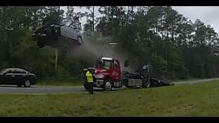 Car launches into the air off a tow trucks ramp in Lowndes County Georgia [upl. by Nedarb698]