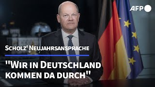 Scholz in Neujahrsansprache quotWir kommen da durchquot  AFP [upl. by Ibbed901]