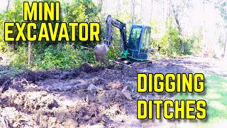 Digging a Drainage Ditch with a Mini Excavator [upl. by Eojyllib]