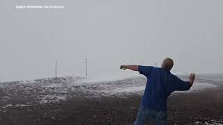 Snow and gusty winds hit inactive volcano summit on Hawaiis Big Island [upl. by Gannon54]