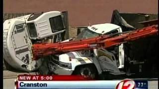 Cranston backhoe falls on top of truck [upl. by Anaidiriv]