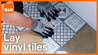 How to install vinyl tile flooring  DIY [upl. by Nemzzaj]