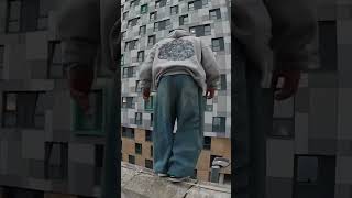 Man Jumps off Roof Slides down Light Post Storror Parkour shorts [upl. by Anitsim]