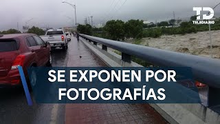 Personas se detienen para tomarle fotos al río Santa Catarina y se exponen ante las fuertes lluvias [upl. by Matuag]