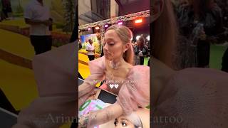 Ariana Grande DRAWS tattoos for fans at wicked premiere [upl. by Yle315]